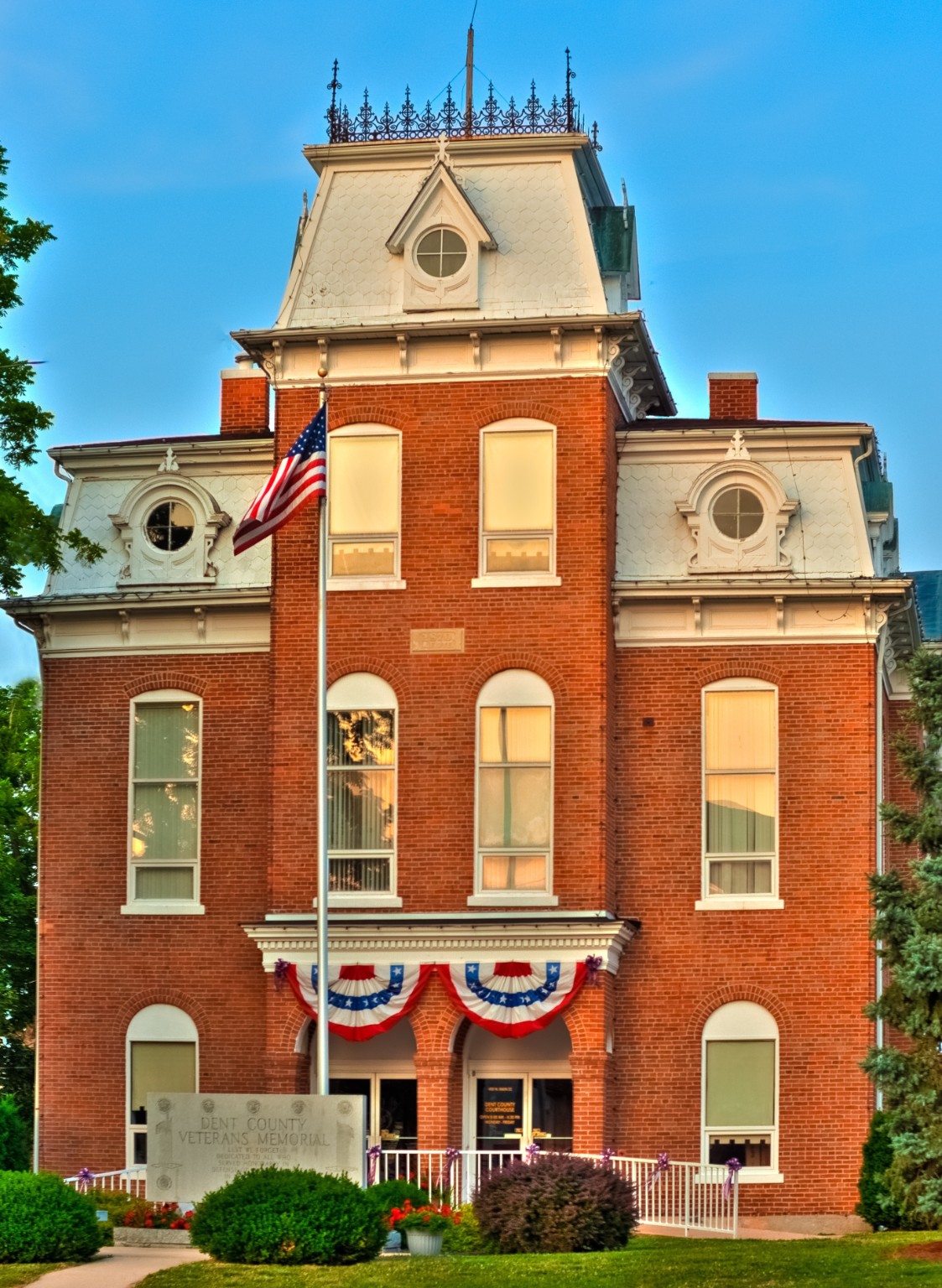Historic red brick courthouse representing a property that could be considered during federal project review.